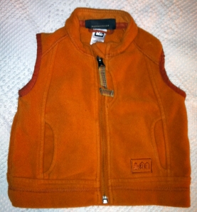 orange REI fleece vest (pre-laundering)